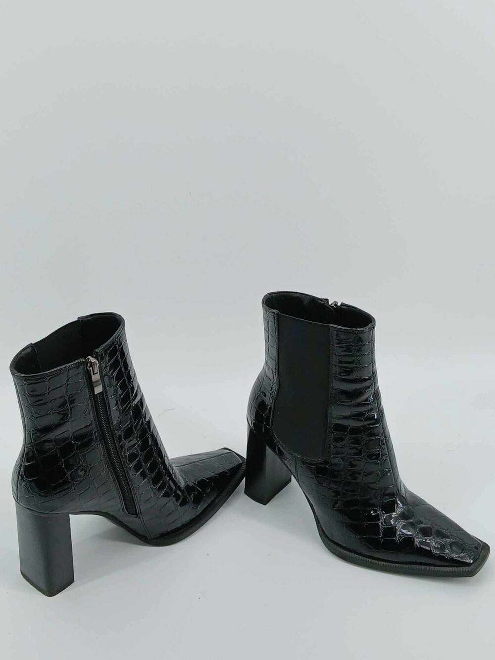 Black snake print ankle boots, Gabrielle Union, square toe western-style